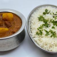 Lamb Vindaloo · A traditional south Indian dish cooked with lamb potatoes and tomato-chile sauce. Served wit...