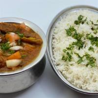Goat Curry · Goat cooked in Indian wok with tomatoes onions and garlic. Served with rice and spiced to yo...
