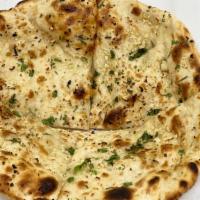 Garlic Naan · Leavened bread with garlic and herbs.