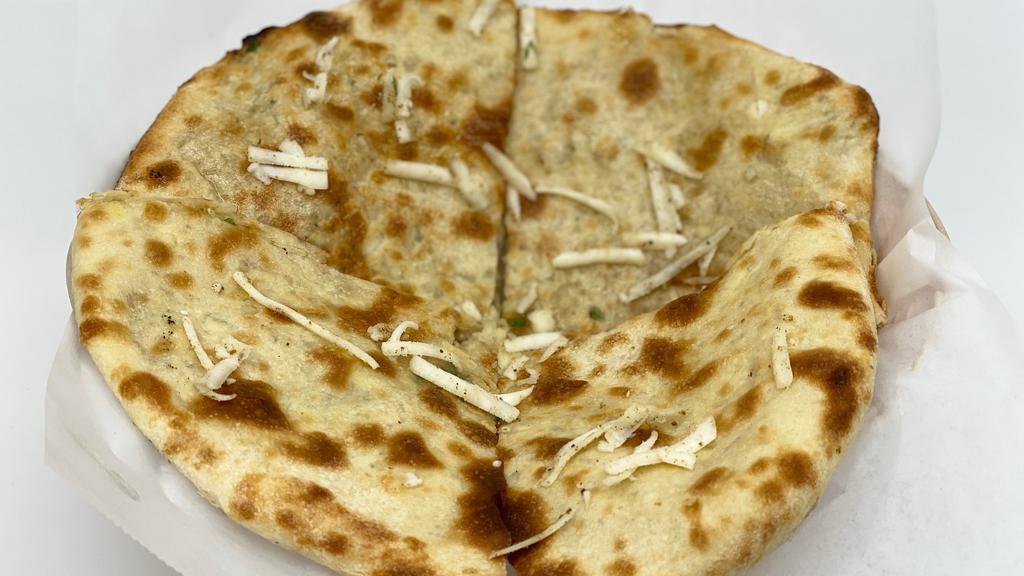 Paneer Naan · Leavened bread stuffed with Indian paneer and cilantro.