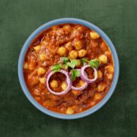 Spiced Chickpea Curry · Delicious and flavourful Indian curry made by cooking chickpeas in a spicy onion tomato masa...