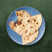 Wheat Flat Bread · Whole wheat flat bread baked to perfection in an Indian clay oven