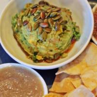 Chips Guac And Salsas · Our chips and guacamole served with ranchera and pina salsa.