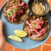 2 Ranchera Tacos · Grilled skirt steak, grilled pineapple salsa, and pickled red onions.