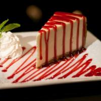 Cheesecake · A rich slice of vanilla cheesecake topped with raspberry, caramel, strawberry, or chocolate ...