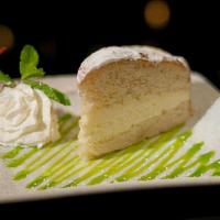 Lemon Cake · Smooth and creamy vanilla and lemon cake, topped with powdered sugar and lime glaze.