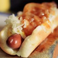 New York Dog · A gourmet hot dog served with mustard, red onion sauce and sauerkraut. Just like the streets...
