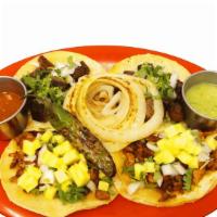 Tacos · One 4″ corn tortilla taco served with onions, cilantro and your choice of meat.