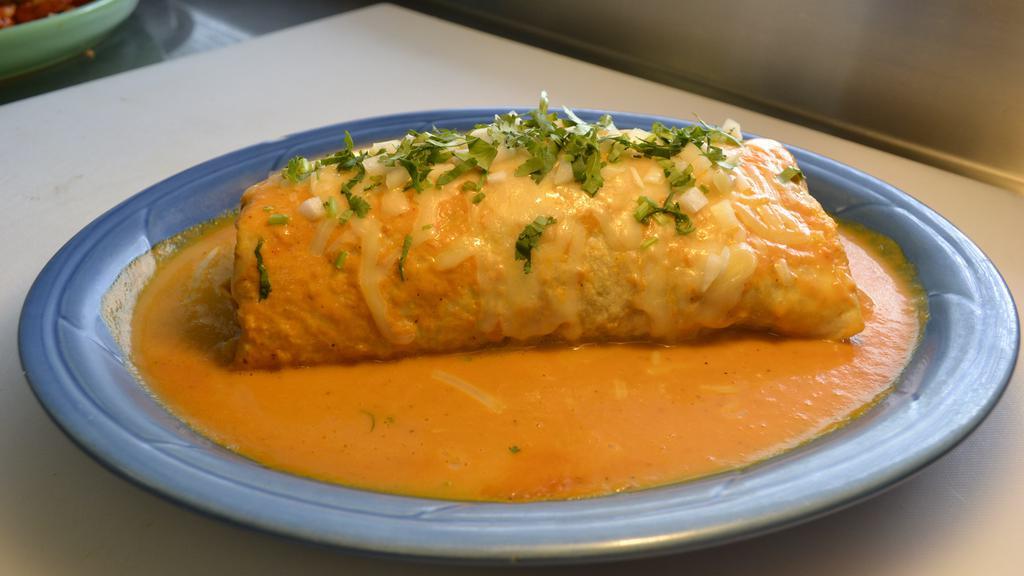 Super Wet Burrito · Your choice of meat, rice, beans, cheese, sour cream, guacamole, cilantro and onions. Comes with your choice of green, red or habanero sauce.