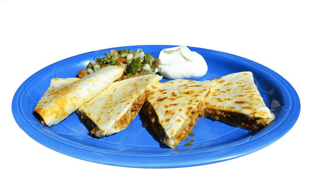 Super Quesadilla · Your choice of meat, cheese, cilantro, onions, salad and sour cream.