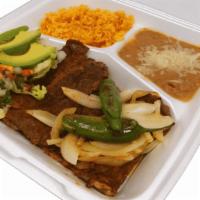 Carne Asada Plate · Carne asada plate served with rice, refried beans, salad, avocado, hot pepper, refried onion...