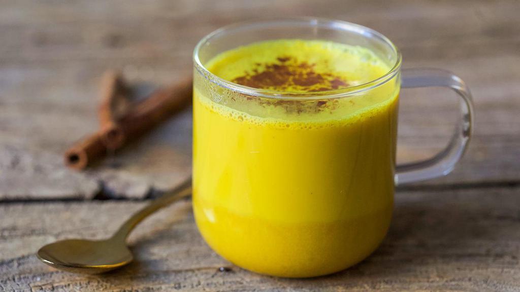 Golden Milk Latte · Turmeric and pear juice, mixed with cashew milk, pure maple syrup, coconut oil and steamed hot. Topped with cinnamon
