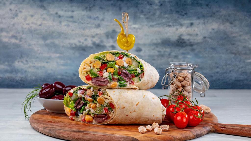 Greek Salad Wrap · Romaine Lettuce - Tomatoes - Red Onions _ Garbanzo Beans - Cucumbers - Kalamata Olives - Feta - Hummus - Tzatziki - Flour Tortilla