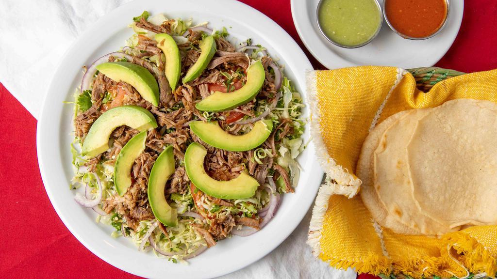 Carnitas Salad  · Thinly sliced cabbage, tomatoes, red onion, cilantro, fresh jalapeños, and lime juice. Mixed with carnitas and avocado. Served with corn tortillas.