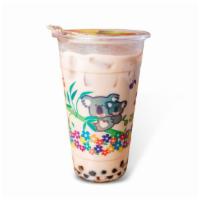 Lychee · Lychee milk tea served with black tapioca pearls sweetened with agave nectar over ice.