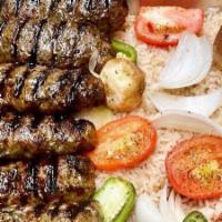 Beef Kabob · Marinated Tender Beef Served With Grilled Tomato, Grilled Onion And Garlic Sauce.