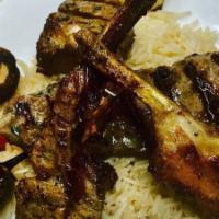 Lamb Chops · Served with pilaf rice and grilled vegetable and choices of lebanese  house or ceasar salad.