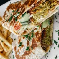 Falafel Sandwich · Deep-fried falafel topped with lettuce, tomatoes, cucumber, onion, tahini sauce, and hummus.