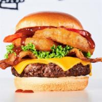 Butch'S Wild Bbq Burger · Burger, BBQ sauce, cheddar cheese, bacon, onion rings, lettuce & tomato