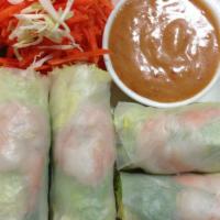 Fresh Rolls · , green leaves, lettuce, basil and carrots wrapped with rice paper. Served with our chef's s...