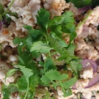 Larb Gai Salad · Charbroiled chicken with mixed onions, cilantro and rice powder in a spicy lime sauce served...