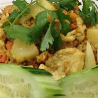 Pineapple Fried Rice · Fried rice with a choice of protein, pineapples, mixed onions, peas, carrots, curry powder a...