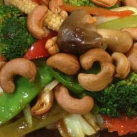 Cashew Veggie · Sauteed cashews, mushrooms, bell peppers, mixed onions, celery, carrots, snow peas, baby cor...