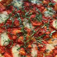 Margherita · Fresh Mozzarella on a Tomato Sauce base.<br />Finished with a drizzle of Olive Oil, a dash o...