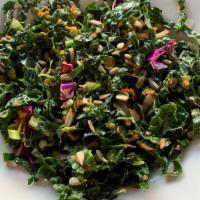 Kale Salad · Fresh Kale, muddled in lemon juice, with shredded carrots, cabbage, and red onions, tossed i...
