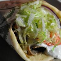 Classic Gyro · Flame broiled seasoned gyro meat, tomato, onion, lettuce & tzatziki