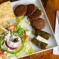 Falafel Patty Plate · House made falafel patties on a bed of lettuce. Served w/tzatziki & pita