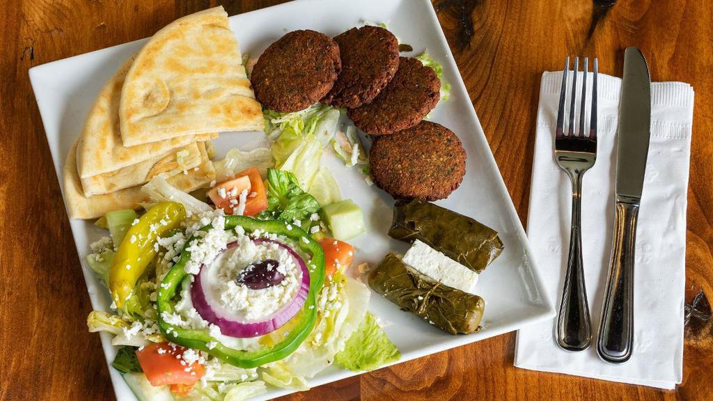 Falafel Patty Plate · House made falafel patties on a bed of lettuce. Served w/tzatziki & pita