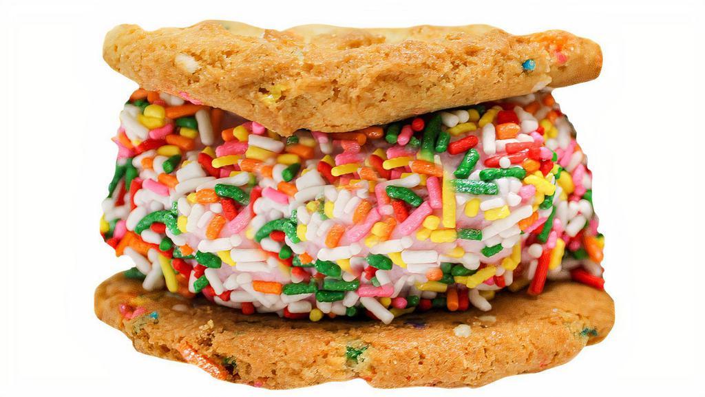 The Howler · Made from scratch Birthday Cake Cookies with Strawberry Ice Cream, rolled in Rainbow Sprinkles.