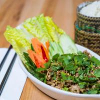 E1 Larb Gai(Chicken) · A savory minced chicken seasoned with lime, chili powder, fish sauce, roasted rice powder an...