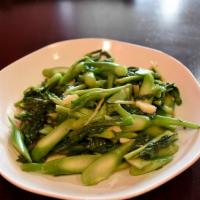 E10 Stir Fry Chinese Broccoli · Stir fried Chinese broccoli with garlic, shallot, oyster sauce, fish sauce and sesame oil. Y...