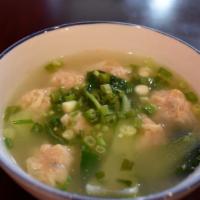 S3 Pork Wonton Soup · Wonton soup with pork dumplings, and bok choy topped with fresh green onions.