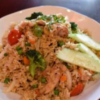F1 Fried Rice · Stir fried rice with tomatoes, snow peas, onions, carrots and eggs.  For chicken, beef, pork...