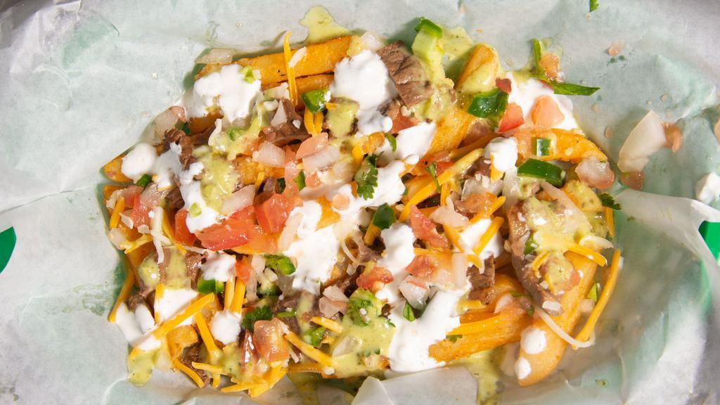Carne Fries · Seasoned Fries Topped With Carne Asada Meat, Pico, Salsa Guac, Sour Cream, Cheddar Cheese, Cilantro.
