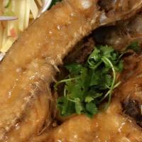 Deep Fried Snapper · Deep fried snapper or Sea bass served with papaya salad on the side.