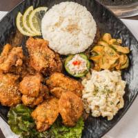 Garlic Chicken · Includes rice and two sides.