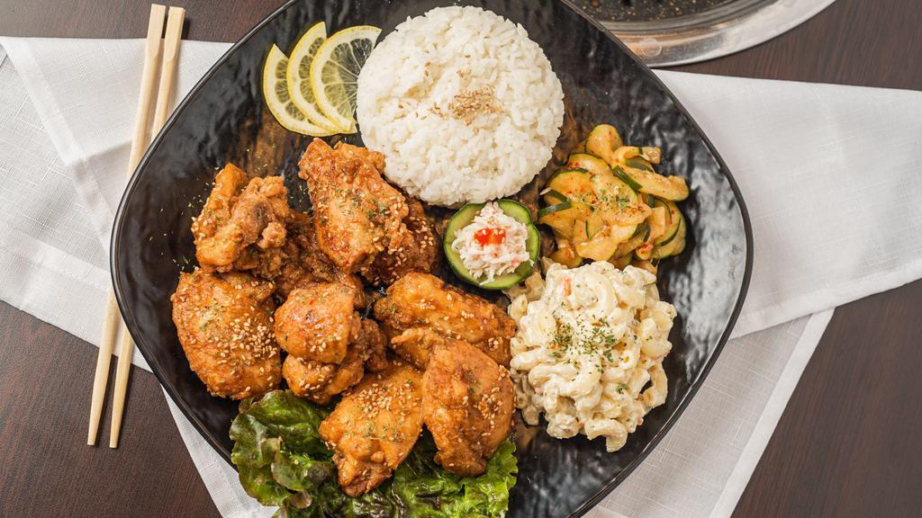 Garlic Chicken · Includes rice and two sides.