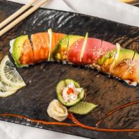 Rainbow Roll · Imitation crab meat, avocado, cucumber topped with raw tuna and salmon.