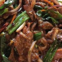 Mongolian Beef · Hot & spicy. Tender beef strips with sliced bell pepper, onion and carrots stir fried in a s...