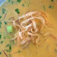 Burmese Khao Soi · Chicken and egg noodles in a flavorful curried chicken broth with a creamy coconut milk base...