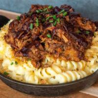 Pulled Pork Mac · House smoked pulled pork in our blackberry ancho bbq sauce on Mary's homemade mac.