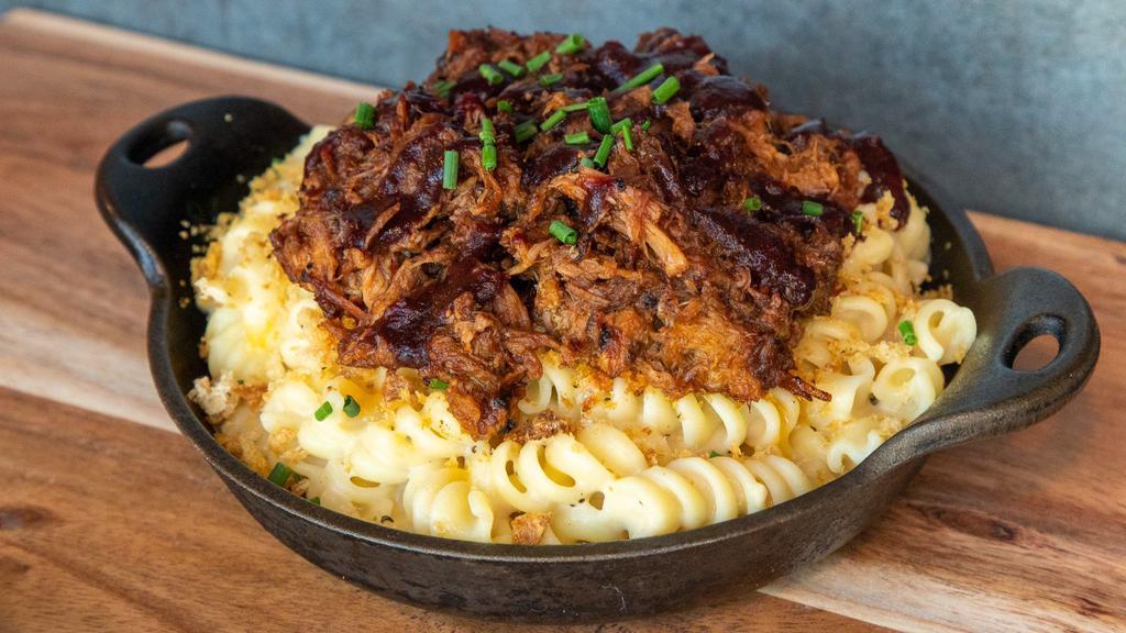 Pulled Pork Mac · House smoked pulled pork in our blackberry ancho bbq sauce on Mary's homemade mac.