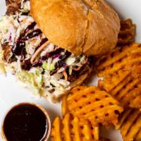 Pulled Pork Sandwich · With waffle fries.