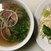 Pho Tai Gan · Rice noodle soup with rare steak and tendon.