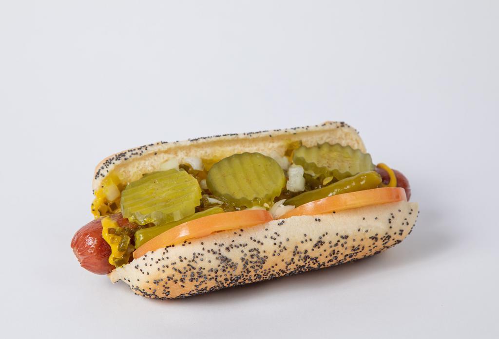 Chicago Dog - Mugsy Style · Mugsy dog, poppy seed bun, relish, mustard, tomato, onions, sport peppers, pickles chips and celery salt.