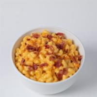 Mac N’ Cheese · Made fresh daily. Topped with cheese crackers and bacon bits.